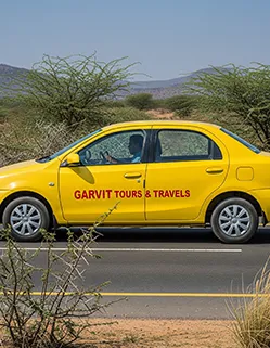 Garvit Tours taxi en route from Jaipur to Jhunjhunu through scenic Rajasthan landscape