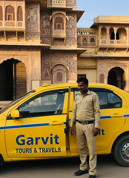 Yellow AC taxi from Garvit Tours parked outside a haveli near Jhunjhunu