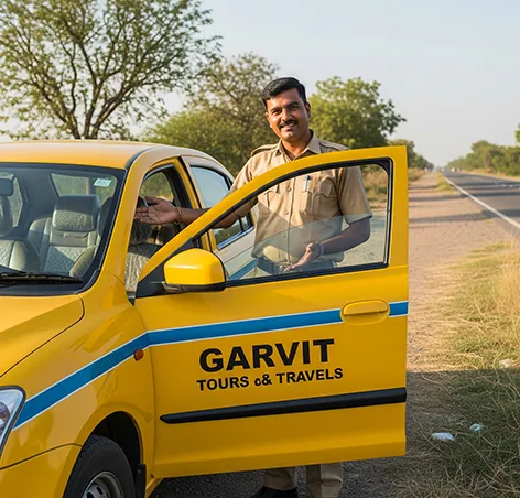 Garvit driver greeting passengers near a yellow taxi on Jaipur to Jhunjhunu route