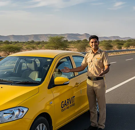 Garvit driver greeting passengers beside a clean yellow taxi on Jhunjhunu to Jaipur route